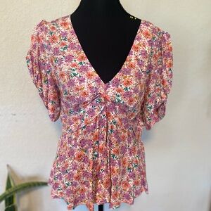 Feminine Cottagecore Short Sleeve Pink Floral V-Neck Top with a Peplum Design